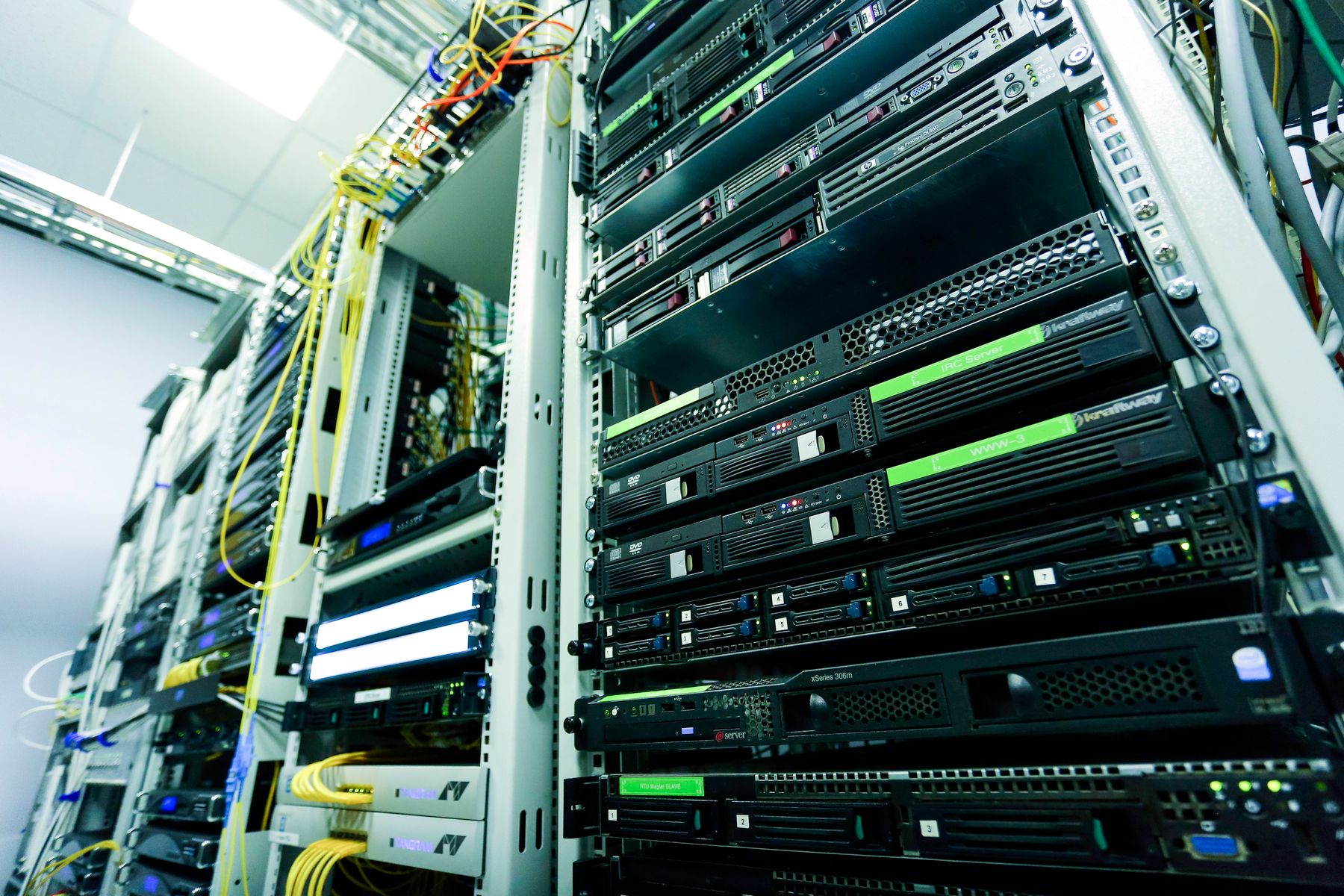 Server units and network connections inside an equipment rack.